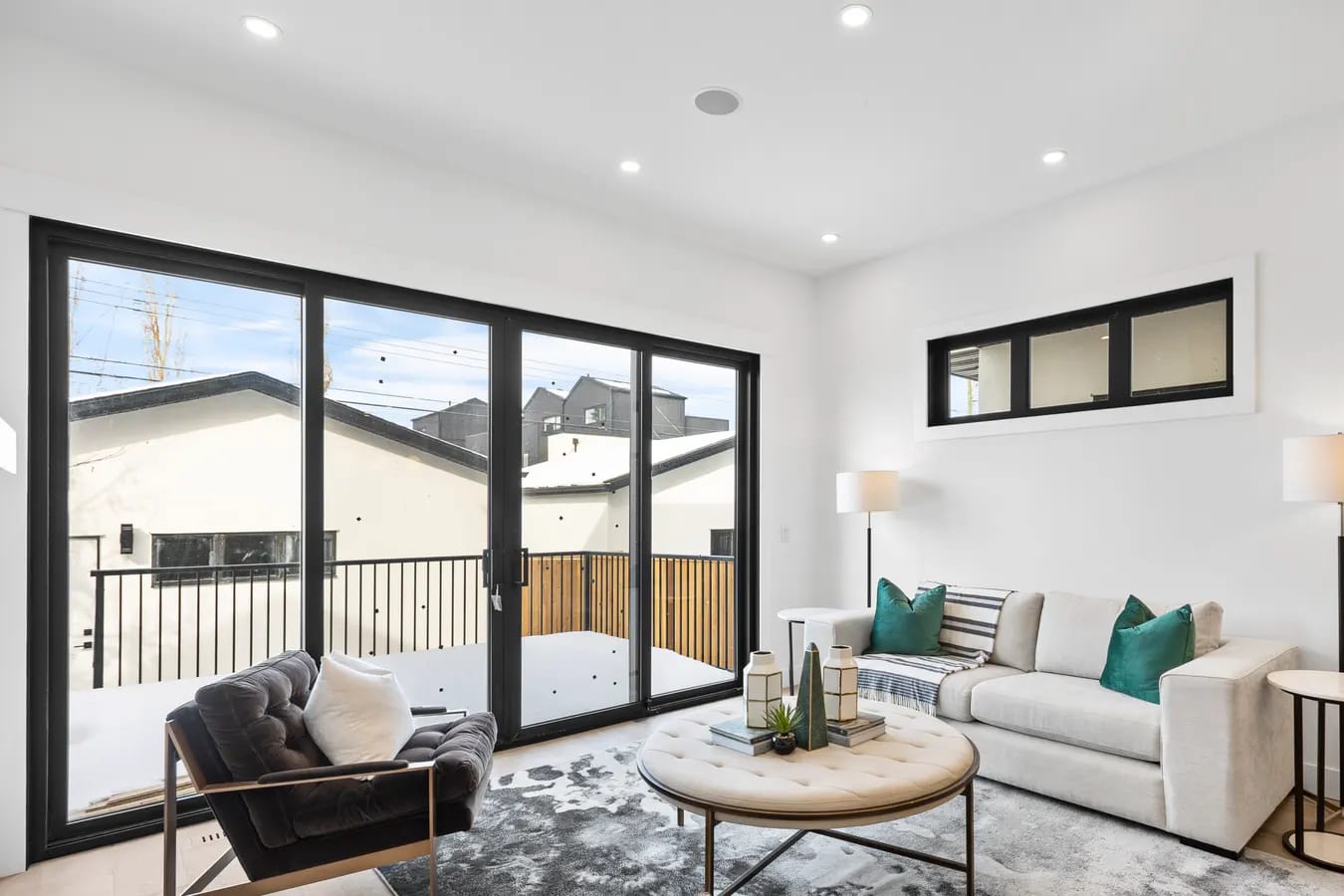 Clean, light-filled luxury living room in a Calgary home prepared for a real estate photo shoot